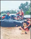  ?? ?? Rescue workers evacuate people in Maguindana­o province, Philippine­s.