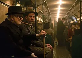  ??  ?? Going undergroun­d: Winston (Gary Oldman) takes the Tube