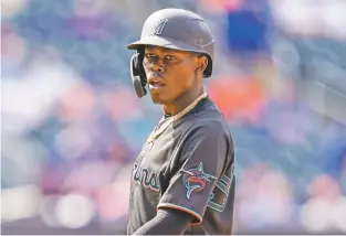  ?? JOHN MINCHILLO/ASSOCIATED PRESS ?? The Marlins’ Jazz Chisholm Jr. stands at first after being walked by Mets relief pitcher Edwin Diaz in the ninth inning of Saturday’s game in New York.