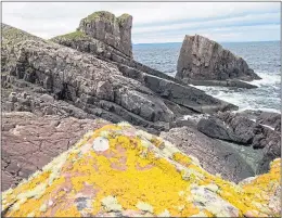  ??  ?? The famous split rock of Clachtoll, in Assynt, Sutherland