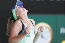  ?? David Gray / AFP via Getty Images ?? Sofia Kenin celebrates after her victory over Ash Barty to reach the Australian Open final.