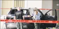  ?? Terry Renna / Associated Press ?? Forensic technician­s work on the vehicle authoritie­s say officers fired shots at, that breached security at President Donald Trump’s Mar-a-Lago resort in Palm Beach on Friday in West Palm Beach, Fla.