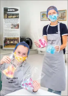  ??  ?? Grace Martin and Sophie Reid showing off some masks they made to raise money for BOFA on their instagram page 2dye4masks.