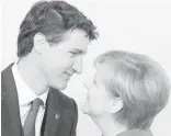  ?? RYAN REMIORZ, THE CANADIAN PRESS ?? Prime Minister Justin Trudeau greets German Chancellor Angela Merkel at the G20 Summit.