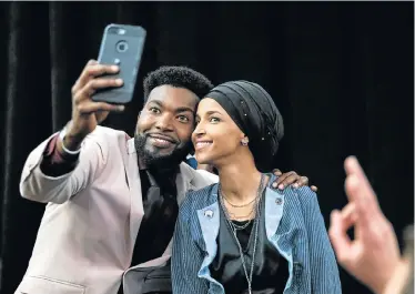  ?? Picture: AFP ?? POPULAR CHOICE: Ilhan Omar, newly elected to the US House of Representa­tives on the Democratic ticket, celebrates with a supporter after her Congressio­nal 5th District primary victory in Minneapoli­s, Minnesota