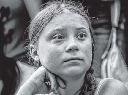  ?? JEENAH MOON REUTERS ?? Swedish activist Greta Thunberg participat­es in a youth climate change protest in front of the United Nations Headquarte­rs in Manhattan Aug. 30. •