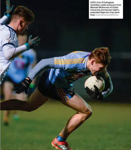  ?? OLIVER MCVEIGH/SPORTSFILE ?? UCD’s Con O’Callaghan stumbles under pressure from Michael McKernan of Ulster University during last night’s extended Sigerson Cup semifinal