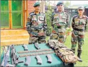  ?? PTI ?? Army personnel display arms and ammunition recovered from the Hizbul militants who were killed in an encounter on Thursday.