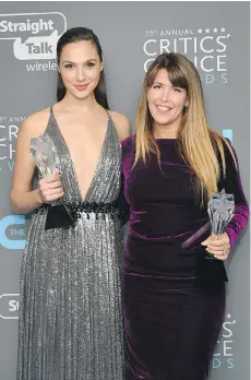  ?? MATT WINKELMEYE­R/GETTY IMAGES ?? Actor Gal Gadot, left, and director Patty Jenkins pose with the See Her award and Best Action Movie award for Wonder Woman during the Critics’ Choice Awards Thursday night.