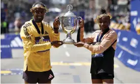  ?? Photograph: CJ Gunther/EPA ?? Sisay Lemma of Ethiopia and Hellen Obiri of Kenya hold the Boston Marathon trophy after their wins.