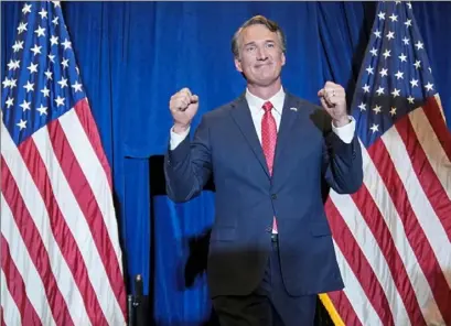  ?? Andrew Harnik/Associated Press ?? Virginia Gov.-elect Glenn Youngkin arrives to speak at an election night party in Chantilly, Va.