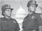  ?? J. SCOTT APPLEWHITE/ AP ?? Acting Capitol Police Chief Yogananda Pittman, left, stands next to Monique Moore in 2012 when they were promoted as the first two African- American women to the rank of captain on the U. S. Capitol Police force.