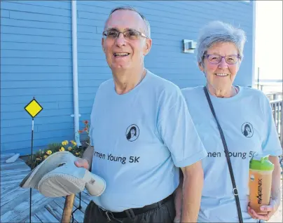  ?? CHRIS SHANNON/CAPE BRETON POST ?? Brian and Nancy Young took a moment to speak about their daughter, Carmen, on Sunday, prior to the start of the first annual Carmen Young 5K Road Race. The Bartown Festival race was renamed in honour of Carmen Young, who died in 1992 following a double lung transplant.