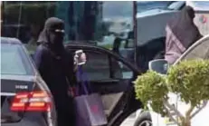  ?? — AFP ?? RIYADH: A Saudi woman disembarks from a car outside a mall in the Saudi capital Riyadh yesterday.