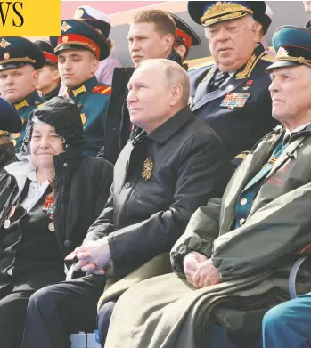  ?? MIKHAIL METZEL / SPUTNIK / AFP VIA GETTY IMAGES ?? Russian President Vladimir Putin watches the Victory Day military parade at Red Square in Moscow on Monday. The country was marking the 77th anniversar­y of its victory over Nazi Germany during the Second World War.
