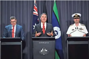  ?? ?? Australian Defense Industry Minister Pat Conroy, left, Defense Minister Richard Marles and nuclear submarine task force head Vice Adm. Jonathan Mead, speak Tuesday in Canberra, Australia. Marles said the submarine deal was necessary to counter the biggest convention­al military buildup in the region since World War II.