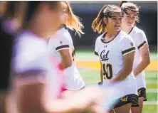  ??  ?? Freshman Ashley Ward (40) and Swanson are Cal’s student ambassador­s for the One Love Foundation.