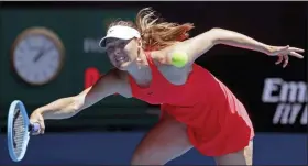  ?? LEE JIN-MAN — THE ASSOCIATED PRESS ?? Maria Sharapova makes a forehand return to Croatia’s Donna Vekic during their first round singles match at the Australian Open tennis championsh­ip in Melbourne, Australia, Tuesday.