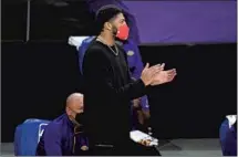  ?? Mark J. Terrill Associated Press ?? ANTHONY DAVIS has watched from the sideline for the last 30 games, with the Lakers going 14-16 and losing LeBron James too.