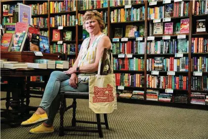  ?? Brett Coomer/Staff photograph­er ?? Valerie Koehler, owner of Blue Willow Bookshop, says it would cost far too much in staffing and time to comply with a new state law requiring books sold to schools to be rated for sexual content. Schools represent about a fifth of her business.