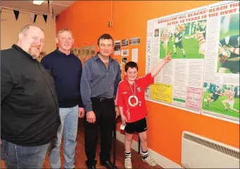  ??  ?? Reliving a county title win by Kiskeam in the Co. JAFC at the presentati­on of archival material at the Kiskeam Lá na gClub were Paudie O’Connor, Richard Dennehy, Donie Cronin and Hugh Patrick O’Connor.