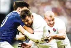  ?? AFP ?? England’s wing Elliot Daly is tackled by France’s fly-half Romain Ntamack during the Six Nations rugby union tournament match between France and England in Saint Denis on Sunday.