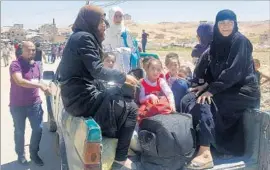  ?? AFP/Getty Images ?? SYRIAN REFUGEES arrive on the outskirts of Arsal, Lebanon, a town where people fleeing Syria’s war have come to outnumber Lebanese residents 2 to 1.