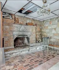  ??  ?? A stone fireplace in the basement.