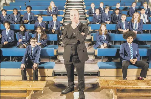  ??  ?? SPOTLIGHT: Principal Dean Jones at Firth Park Academy with pupils in the third series of Our School, the fly-on-the-wall documentar­y about life in the first year of secondary school.