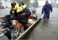  ??  ?? Rescuing the stranded in New Bern, N.C.