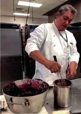  ?? ARLIE DOXTATOR ?? Chef Arlie Doxtator prepares a mixed berry sauce.