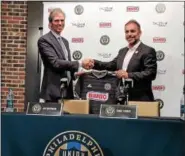  ?? SUBMITTED PHOTO ?? Union owner Jay Sugarman, left, shakes hands with new sporting director Ernst Tanner at Tanner’s introducto­ry press conference Thursday at Talen Energy Stadium.