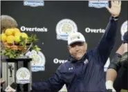  ?? ASSOCIATED PRESS FILE ?? This file photo shows Notre Dame head coach Brian Kelly celebratin­g with the championsh­ip trophy after defeating LSU 21-17in the Citrus Bowl NCAA college football game in Orlando, Fla. Notre Dame won 21-17. Kelly has holes to fill on the offensive line...