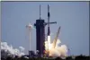  ?? CHRIS O’MEARA - THE AP ?? A SpaceX Falcon 9 rocket with the Crew Dragon capsule attached, lifts off with the first private crew from Launch Complex 39A Friday, at the Kennedy Space Center in Cape Canaveral, Fla.