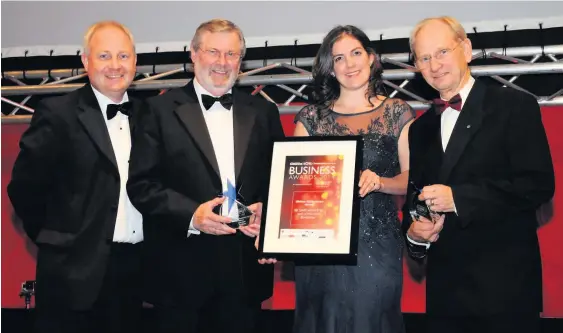  ??  ?? John Deer, second left, and Sir David Mcmurtry, right, receive the first Lifetime Achievemen­t Award from Stewart Barnes and Rachel Ramos from Quolux