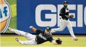  ?? KATHY KMONICEK/AP ?? Giancarlo Stanton, left, and Marcell Ozuna are candidates for Gold Gloves, in right field and left field, respective­ly.