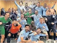  ??  ?? DERBY VICTORS City in the Old Trafford dressing room