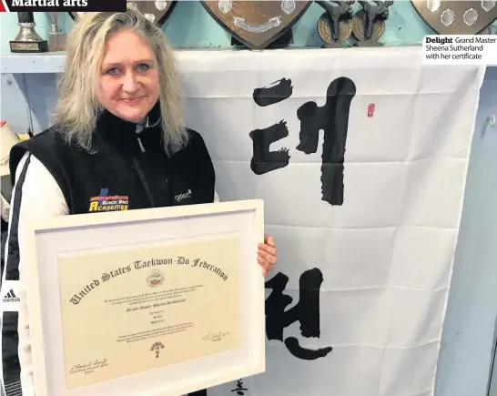  ??  ?? Delight Grand Master Sheena Sutherland with her certificat­e