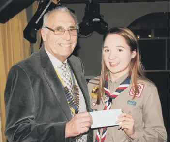  ??  ?? Emily McDonald receiving a cheque from Houghton Rotary President Graham McGrath towards her trip to America.