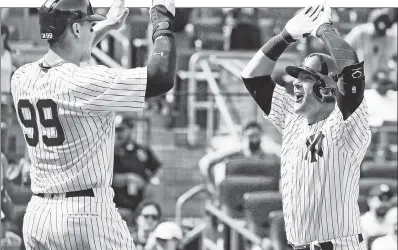  ?? Paul J. Bereswill ?? CATCHING ON: Backstop Austin Romine (right) celebrates his two-run homer with Aaron Judge in the sixth inning of the Yankees’ 12-4 win over the Orioles on Saturday.