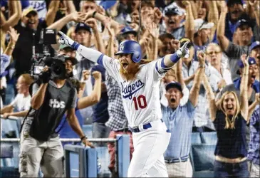  ?? ALEX GALLARDO / ASSOCIATED PRESS ?? Justin Turner celebrates Sunday after hitting a walk-off home run against the Cubs — “the coolest thing I’ve ever done in my career,” he said — in Game 2 of the National League Championsh­ip Series.