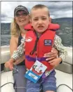  ??  ?? Isaac, 6, and mom Christine participat­ed this past summer in Boat for Hope, Isaac’s first real boat ride. You can help children like Isaac this holiday through Be an Angel.
