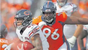  ?? David Zalubowski, Associated Press file ?? Broncos defensive tackle Shelby Harris pursues the Chicago Bears’ David Montgomery last season.