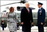  ?? AP/JACQUELYN MARTIN ?? President Donald Trump and first lady Melania Trump board Air Force One on Friday at Andrews Air Force Base in Maryland as they head to Paris, where they will participat­e in World War I commemorat­ions.