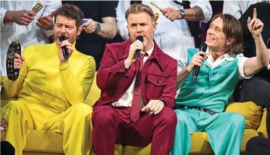  ?? ?? That’s entertainm­ent: Howard Donald, Gary Barlow and Mark Owen delighting their loyal fans in South Yorkshire