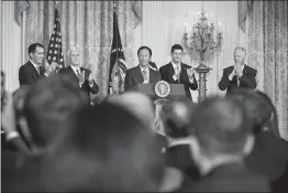  ?? JUSTIN GILLILAND / THE NEW YORK TIMES ?? Terry Gou, the founder of Foxconn, center, announces Wednesday at the White House that it will open its first major factory in America. From left: Gov. Scott Walker of Wisconsin, Vice President Mike Pence, Gou, Rep. Paul Ryan, R-wis., and Sen. Ron Johnson, R-wis.