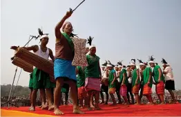  ?? — AP ?? Garo tribals in ethnic costumes perform Wangala dance during Prime Minister Narendra Modi’s campaign rally at Phoolbari village in Garo Hills, Meghalaya, on Thursday.