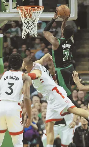  ?? STAFF PHOTO BY NICOLAUS CZARNECKI ?? EASY BUCKET: Celtics guard Jaylen Brown (7) scores in the first quarter of last night’s 110-99 victory against the Eastern Conference-leading Toronto Raptors at the Garden.