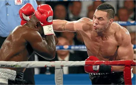  ?? PHOTOS: PHOTOSPORT ?? Joseph Parker swings a right at Carlos Takam but the New Zealander may lack the size and the reach to handle British heavyweigh­t Anthony Joshua.