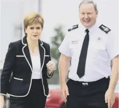  ??  ?? 0 Nicola Sturgeon meets Chief Fire Officer Alasdair Hay